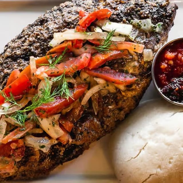 A Ball of Banku and Tilapia Fish.