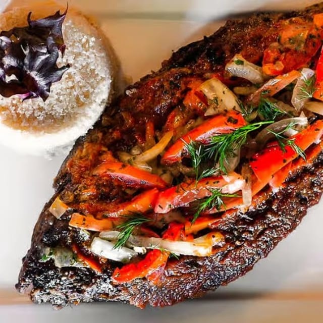 Atteike or White Rice and Tilapia Fish.