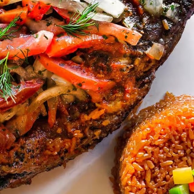 Jollof Rice and Tilapia Fish.