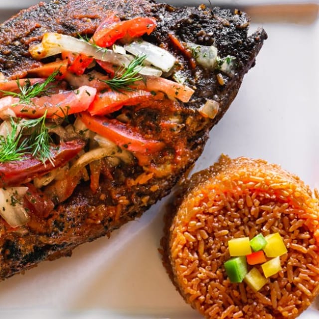 Jollof Rice and Tilapia Fish.