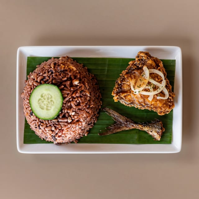 Waakye and Fried Fish or Chicken.