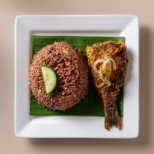 Waakye and Fried Fish or Chicken.